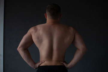 athletic guy strains his back