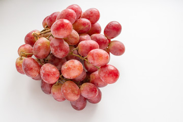 bunch of red grapes on a white background