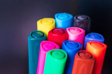 Colorful marker pens isolated on dark background. Multi colors background concept 2