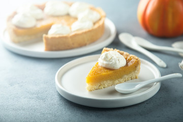 Homemade pumpkin pie with whipped cream