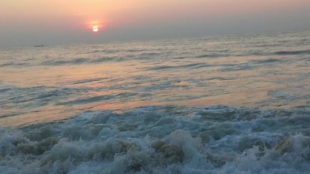 4K Sunrise over tropical island beach and palm trees. Phuket beach sea, View of beach sea on sun light in the summer. Colorful sunset over the beach in the tropical beach sea,the tropical paradise bea