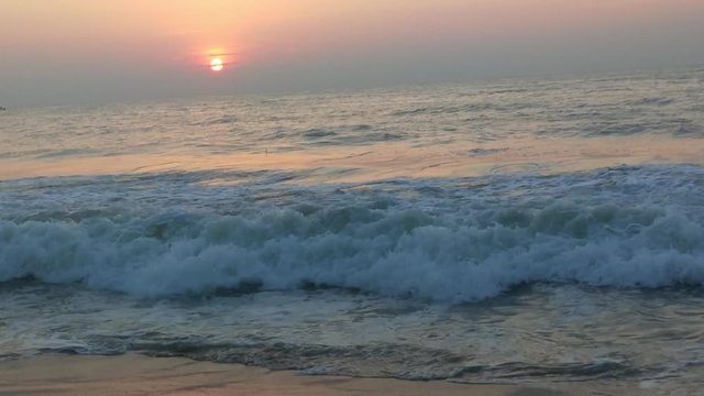 4K Sunrise over tropical island beach and palm trees. Phuket beach sea, View of beach sea on sun light in the summer. Colorful sunset over the beach in the tropical beach sea,the tropical paradise bea