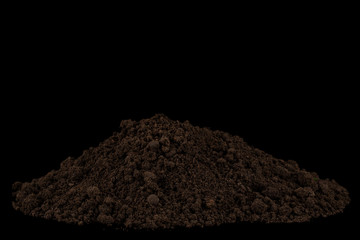 Heap of soil isolated on black background
