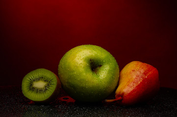 apple kivi fruit knife cut background red black vitamins healthy food