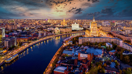 Fototapeta premium Moscow skyline and skycraper historical architecture, Moscow City business and financial and hotel with Moscow River at twilight, Aerial view traffic and bridge with Arbat street, Russia.