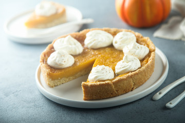 Homemade pumpkin pie with whipped cream