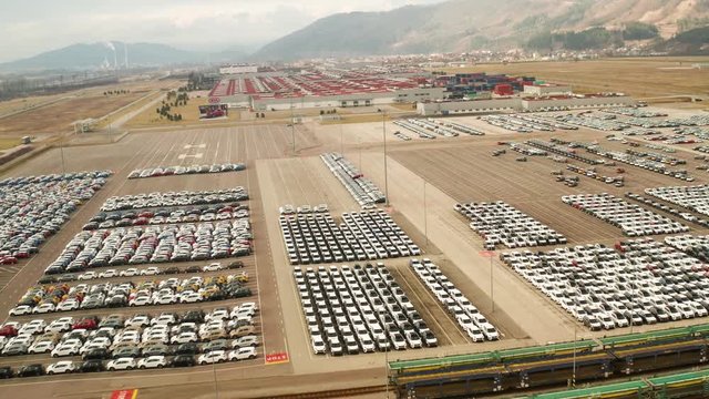 large parking lot of new cars from car factory in slovakia , kia 