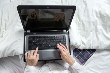 Adult woman working at home in pijama