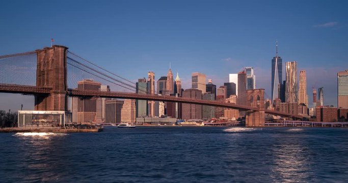 Wide panoramic view of Brooklyn bridge and downtown Manhattan seen from BUMBO early morning time lapse. New York city, NY, USA.