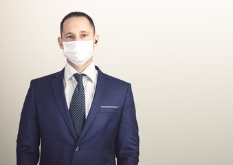 Close up portrait of handsome man in a protective medical mask