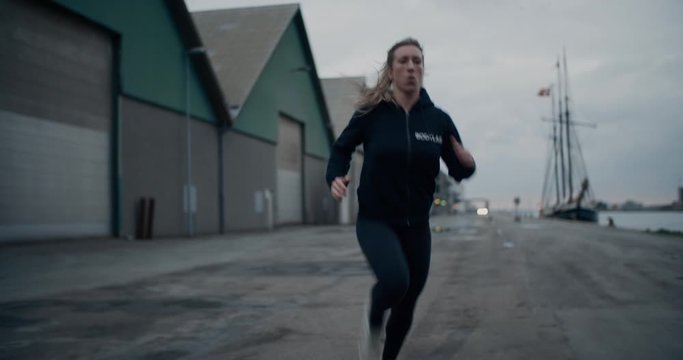 Athlete Running Along Path At Docks