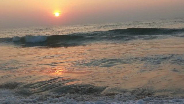 4K Sunrise over tropical island beach and palm trees. Phuket beach sea, View of beach sea on sun light in the summer. Colorful sunset over the beach in the tropical beach sea,the tropical paradise bea
