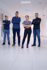 Business, education and sucess concept, Group of Young business people standing and looking at camera.