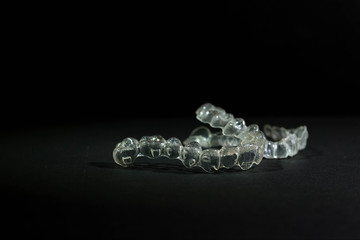 invisible dental appliance insulated on a black background. Concept dental corrector