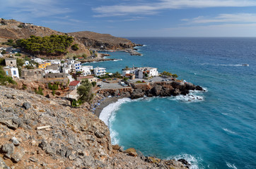 Fototapeta na wymiar Top view of Vrissi beach and the town of Hora Sfakion (Sfakia) on the south coast of the island of Crete, Greece. 