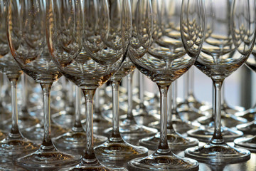 Many empty wine glasses in the bar