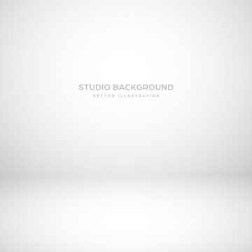 Empty gray studio abstract background with spotlight effect. Product showcase backdrop.