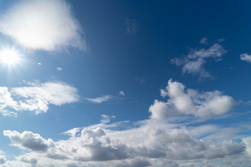 Naklejka na ściany i meble blue sky with white floating clouds, weather