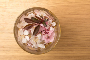 Cherry blossom , pink sakura flower isolated on wooden background
