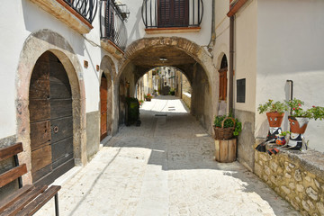 Fototapeta na wymiar Pacentro, Italy. A narrow street between the old houses of a medieval village