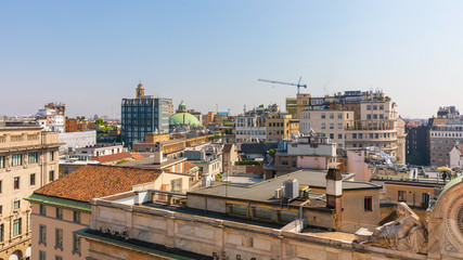 View on roofs with a top of dome of the Basilica San Carlo al Corso of Milan