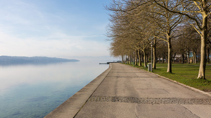 Starnberg, Bavaria / Germany - Mar 27, 2020: Empty promenade at Lake Starnberg. Usually a popular and crowded place. Due to the Coronavirus (Covid-19) and the related restrictions nobody is there.  © Chris Redan