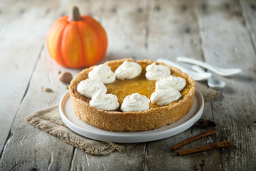 Homemade pumpkin pie with whipped cream