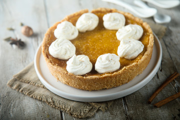 Homemade pumpkin pie with whipped cream