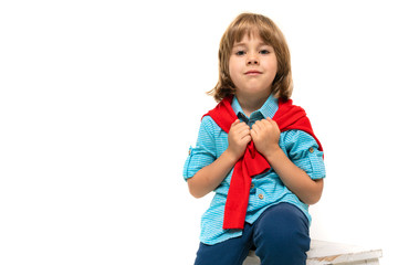 handsome european boy in blue shirt posing on white isolated studio background