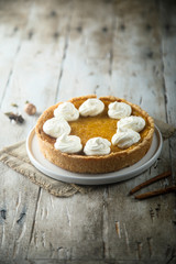 Homemade pumpkin pie with whipped cream