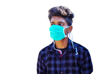Close up of Young South Asian boy wearing mask against the corona virus covid 19 brown man wearing surgical mask to prevent from virus white background.