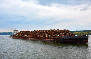 Scrap metal on a barge on a river in Germany