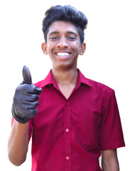 Smiling young mechanic in uniform with showing thumbs up in white background