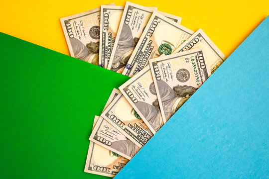 Cash Money on colorful background, Fan of 100 dollar bills on color background, copy space for you text