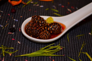 spices in a wooden spoon