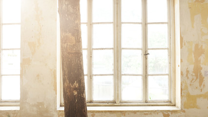 Fototapeta premium Industrial vintage interior with bright light coming through windows. - Image