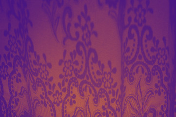 Fascinating purple and orange ornamets created by sun from the window. Abstract gradient beautiful background with geometric shape shadows of bright sunlight