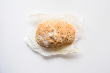 Freshly baked bread isolated on white background, top view