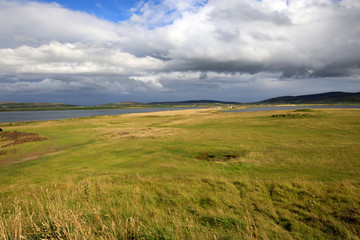 Obraz premium Brodgar - Orkney (Scotland), UK - August 06, 2018: The country near Ring of standing stones at Brodgar, Orkney, Scotland, Highlands, United Kingdom