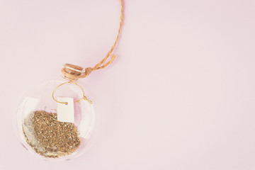 Background, bottle, gold, pink, flat lay. Decor, bottle, glitter, pink, gold. Bottle with gold glitter. Spring concept. Place for your text.