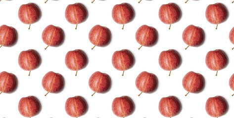 Seamless pattern of red apples on white background. Food texture