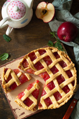 Homemade baking. Sweet apple pie on a rustic wooden table. Top view flat lay background. Copy space.
