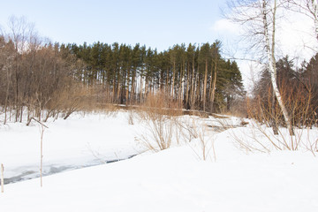 Winter rural river snowy landscape. Forest river in winter snow. Winter Forrest River Peisash