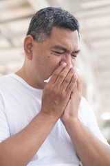 Fototapeta premium allergic sick old man sneezing flu; concept of man with coronavirus covid-19 infection spreading the disease, allergy, sore throat or lung inflammation, pneumonia, influenza, flu, cold, sickness