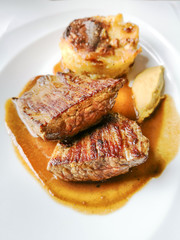 juicy steak beef meat with tomato and potatoes