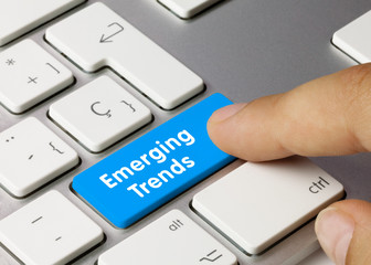 Emerging Trends - Inscription on Blue Keyboard Key..