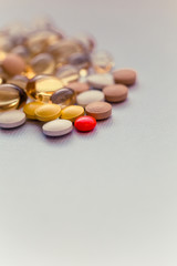 Cod liver oil capsules in a fish shape with copy space. Healthcare concept