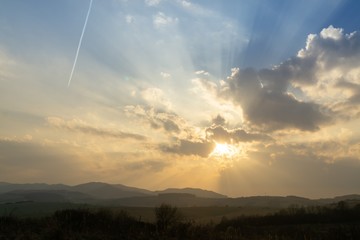 Sunrise or sunset over the hills and meadow. Slovakia