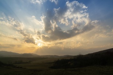 Sunrise or sunset over the hills and meadow. Slovakia
