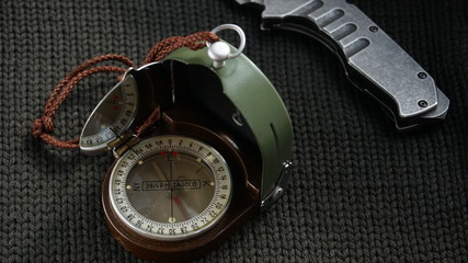 Old compass with a knife